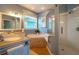 Elegant bathroom with soaking tub and walk-in shower at 7007 Holmes Blvd, Holmes Beach, FL 34217