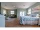 Bright bedroom featuring a comfortable bed and sitting area at 7007 Holmes Blvd, Holmes Beach, FL 34217