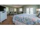 Spacious bedroom with sitting area and private balcony access at 7007 Holmes Blvd, Holmes Beach, FL 34217