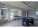 Finished basement with ping pong and foosball tables at 7007 Holmes Blvd, Holmes Beach, FL 34217