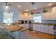 Bright kitchen featuring granite countertops and stainless steel appliances at 7007 Holmes Blvd, Holmes Beach, FL 34217