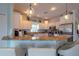 Modern kitchen with a breakfast bar and granite countertops at 7007 Holmes Blvd, Holmes Beach, FL 34217