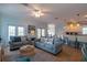 Spacious living room with two sofas, and access to balcony at 7007 Holmes Blvd, Holmes Beach, FL 34217