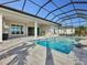 Luxury pool and lanai with outdoor kitchen and covered patio at 8372 Sea Glass Ct, Sarasota, FL 34240