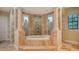 Luxury bathroom featuring a large soaking tub and shower at 855 Macewen Dr, Osprey, FL 34229