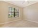 Bright bedroom with large window and carpet flooring at 855 Macewen Dr, Osprey, FL 34229