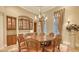 Elegant dining room featuring a round table, built-in buffet, and a chandelier at 855 Macewen Dr, Osprey, FL 34229