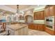 Island kitchen with granite countertop and stainless steel appliances at 855 Macewen Dr, Osprey, FL 34229