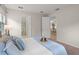 Spacious bedroom with ensuite bathroom access and neutral decor at 8792 Rain Song Rd, Sarasota, FL 34238
