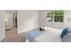Comfortable bedroom with a king-size bed and access to a patio at 8792 Rain Song Rd, Sarasota, FL 34238