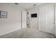 Simple bedroom with neutral walls and carpet flooring at 8792 Rain Song Rd, Sarasota, FL 34238