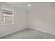 Bright bedroom with large window and ceiling fan at 8792 Rain Song Rd, Sarasota, FL 34238