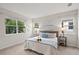Bright bedroom with a king-size bed and plenty of natural light at 8792 Rain Song Rd, Sarasota, FL 34238