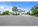 Gated entrance to community with palm trees at 8792 Rain Song Rd, Sarasota, FL 34238