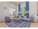 Community room with seating area and large windows at 8792 Rain Song Rd, Sarasota, FL 34238