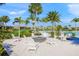 Cozy fire pit area with white Adirondack chairs at 8792 Rain Song Rd, Sarasota, FL 34238
