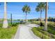 Community grilling area with tables and lake views at 8792 Rain Song Rd, Sarasota, FL 34238