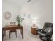 Home office features a large desk and comfortable seating at 8792 Rain Song Rd, Sarasota, FL 34238