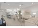 Open-concept living space with light, airy feel and modern furniture at 8792 Rain Song Rd, Sarasota, FL 34238