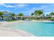 Community pool with spacious deck and nearby clubhouse at 8792 Rain Song Rd, Sarasota, FL 34238