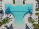 Resort-style pool with palm trees and lounge chairs at 8792 Rain Song Rd, Sarasota, FL 34238
