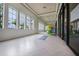 Bright yoga studio with wood floors and large windows at 8792 Rain Song Rd, Sarasota, FL 34238
