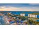 Coastal aerial featuring beachfront homes and condos along a picturesque shoreline with ocean views at 9393 Midnight Pass Rd # 201, Sarasota, FL 34242
