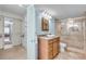 Bathroom featuring vanity, toilet, and tiled shower with glass door at 9393 Midnight Pass Rd # 201, Sarasota, FL 34242