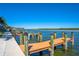 Community docks for boating and fishing with stunning water views at 9393 Midnight Pass Rd # 201, Sarasota, FL 34242