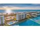 Waterfront condo building with tennis courts, a swimming pool, and boat docks on the Intracoastal at 9393 Midnight Pass Rd # 201, Sarasota, FL 34242