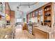Kitchen with granite countertops, stainless steel appliances, and custom cabinetry at 9393 Midnight Pass Rd # 201, Sarasota, FL 34242