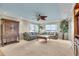 Cozy living room with stylish decor, a ceiling fan, and bright natural light at 9393 Midnight Pass Rd # 201, Sarasota, FL 34242
