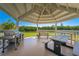 Community pavilion featuring grill and picnic tables with stunning views of the water at 9393 Midnight Pass Rd # 201, Sarasota, FL 34242