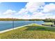 Beautiful waterfront view with a grassy area, perfect for relaxing by the water at 9393 Midnight Pass Rd # 201, Sarasota, FL 34242