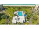 Aerial view showing resort-style pool and beach access at 1055 Gulf Of Mexico Dr # 504, Longboat Key, FL 34228