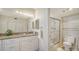 Bathroom with shower stall, toilet and granite vanity at 1055 Gulf Of Mexico Dr # 504, Longboat Key, FL 34228