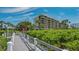 Private boardwalk to beach through lush landscaping at 1055 Gulf Of Mexico Dr # 504, Longboat Key, FL 34228
