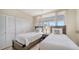 Guest bedroom with two twin beds and built-in closet at 1055 Gulf Of Mexico Dr # 504, Longboat Key, FL 34228