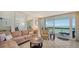 Living room with ocean view and comfortable seating at 1055 Gulf Of Mexico Dr # 504, Longboat Key, FL 34228