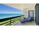 Stunning ocean view from a condo balcony with lounge chair at 1055 Gulf Of Mexico Dr # 504, Longboat Key, FL 34228