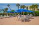 Enjoy the outdoors at this community patio, complete with tables, chairs, and umbrellas at 1055 Gulf Of Mexico Dr # 504, Longboat Key, FL 34228