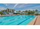 Resort-style pool with ample deck space and lounge chairs at 1055 Gulf Of Mexico Dr # 504, Longboat Key, FL 34228