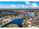 An aerial view of a residential community featuring several homes and a large lake at 12342 Lavender Loop, Bradenton, FL 34212