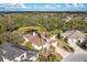 Top-down view of a home in a residential neighborhood, surrounded by trees and other houses at 12342 Lavender Loop, Bradenton, FL 34212
