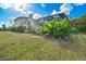Lush backyard with screened-in pool enclosure at 12342 Lavender Loop, Bradenton, FL 34212
