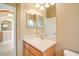 Bathroom with single vanity, mirror, and neutral colors at 12342 Lavender Loop, Bradenton, FL 34212