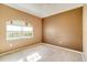 Empty bedroom with carpet, window, and neutral walls at 12342 Lavender Loop, Bradenton, FL 34212