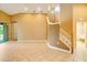 Living area with tile floors, staircase, and neutral walls at 12342 Lavender Loop, Bradenton, FL 34212
