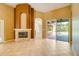 Living room with fireplace, tile floors, and access to the pool at 12342 Lavender Loop, Bradenton, FL 34212
