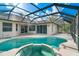 Screened-in pool with a connecting spa, perfect for relaxation and outdoor enjoyment at 12342 Lavender Loop, Bradenton, FL 34212